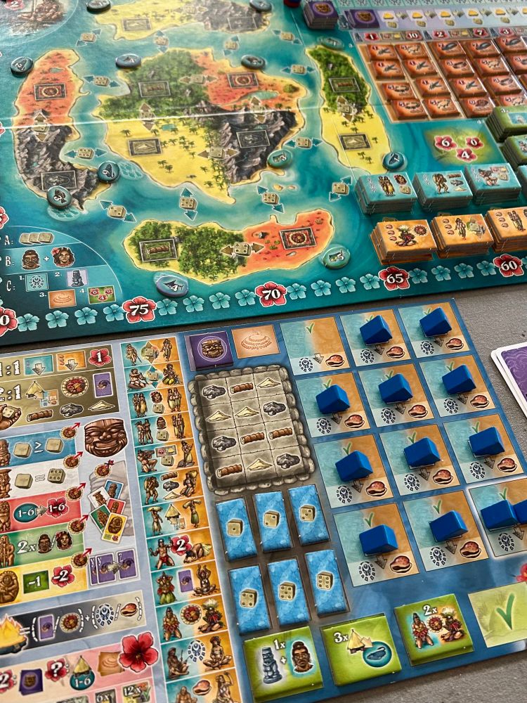 Player board for Bora Bora with blue player tokens and tiles 