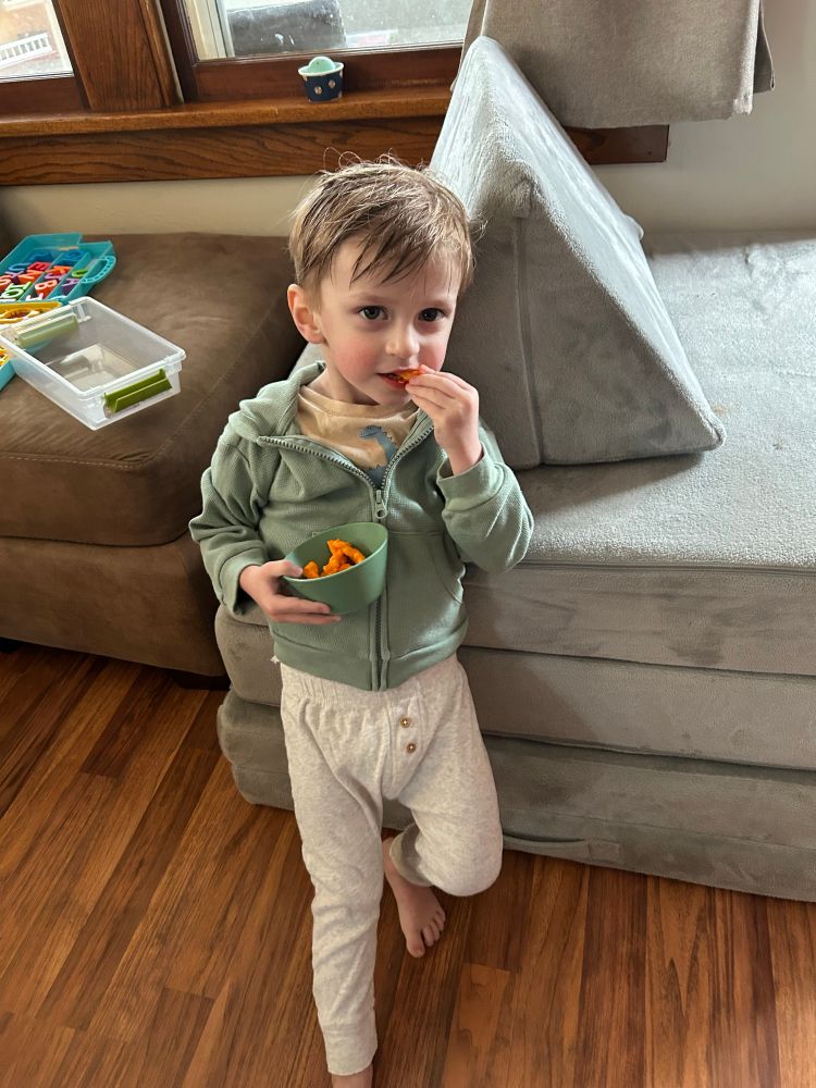 JJ (2.5 yrs old) posing with some Cheetos