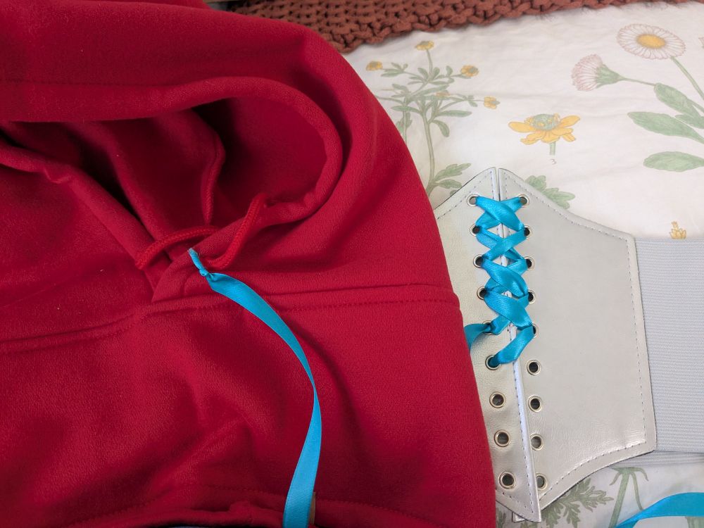 Red hood with silver corset and blue lacing 