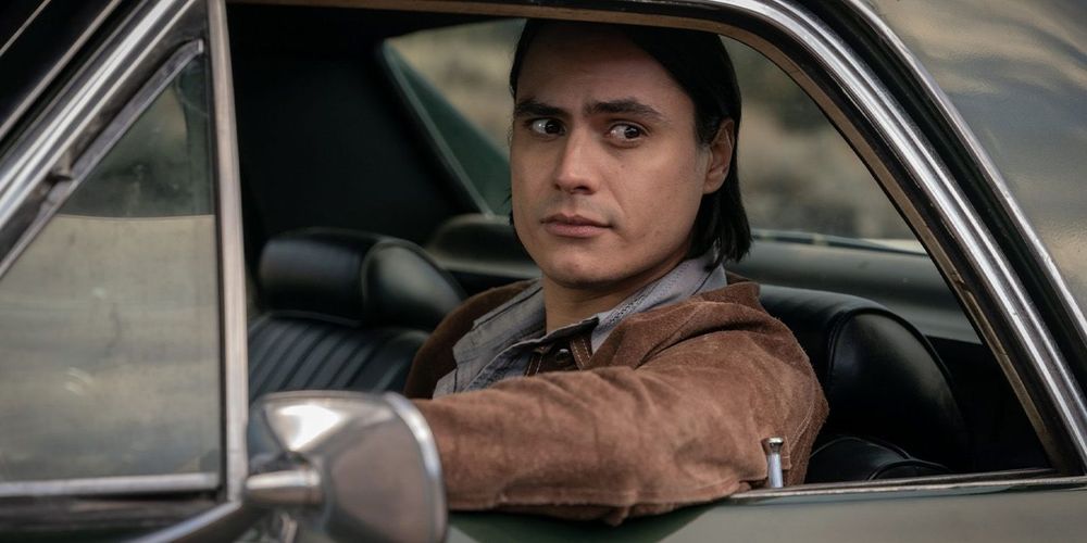 Character Jim Chee from Dark Winds sitting in a car 