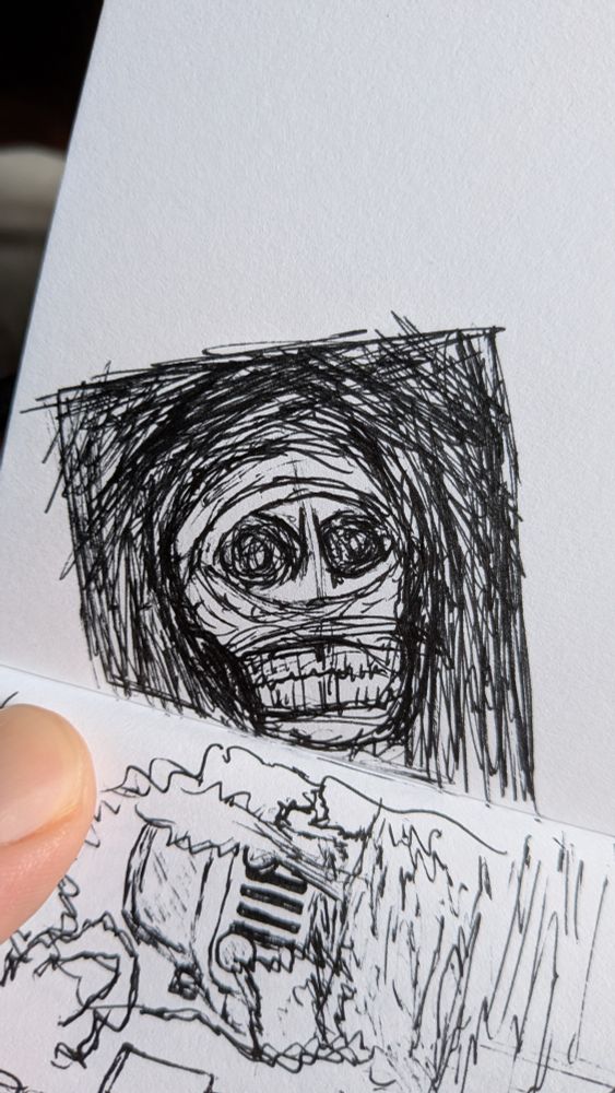 Sketch of a skull wrapped in cloth with the eye sockets and teeth showing. Rapidly placed lines behind it make the skull appear as if coming out of darkness.