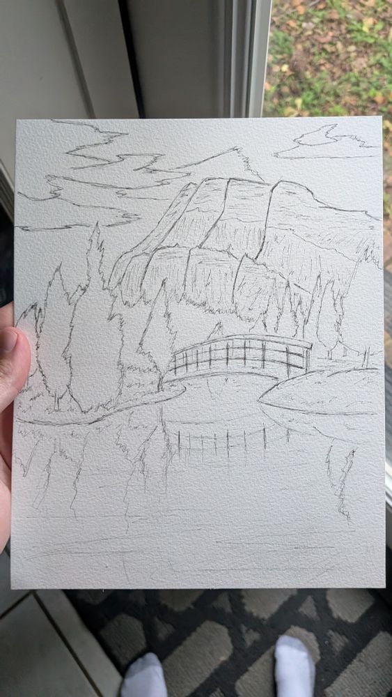 Paper and ink sketch of a bridge over two ends of an inlet, looked over by tall plateaus in the background against a sky with scattered clouds.