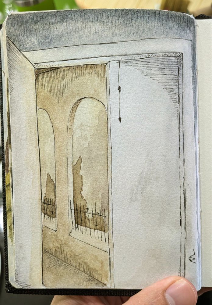 Watercolor painting on paper of a doorway leading out to a well lit path bordered by concrete arches. A low iron fence sits between the struts, and beyond are the hazy outlines of bushes and city skyline.