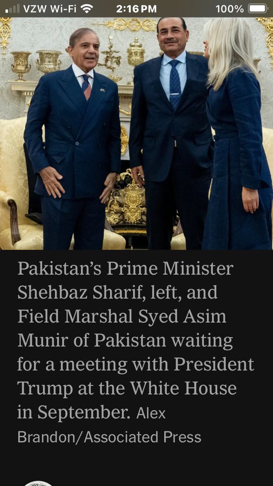 People standing, surrounded by golden junk