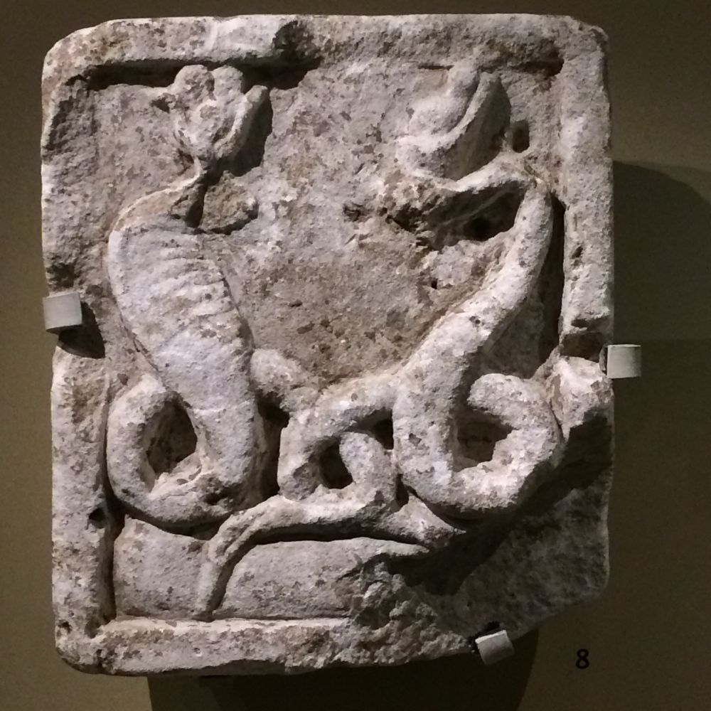 A square Limestone relief of Isis and Serapis as snake-gods. 