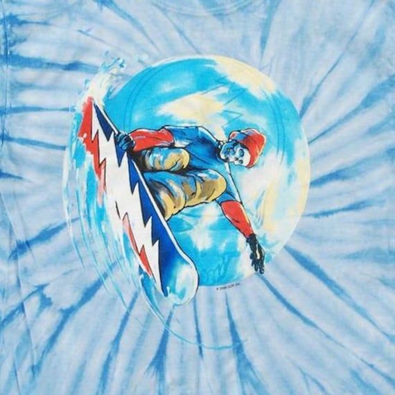 Skeleton on a snowboard with a Grateful Dead bolt on the bottom of the board. 