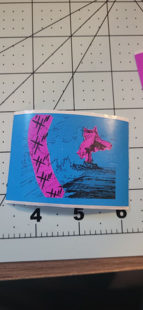 Thermal printed sticker of eva unit 02 standing on a battleship. A base blue print has been overlayed with pink highlights of the eva and sound effects