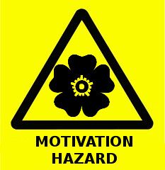A yellow and black, triangle warning sign labeled: Motivation Hazard. There is a stylized poppy in the center.
