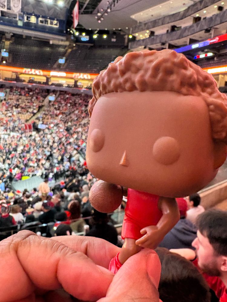 Scottie Barnes Funko Pop ProtoType with the ScotiaBank crowd in the background 