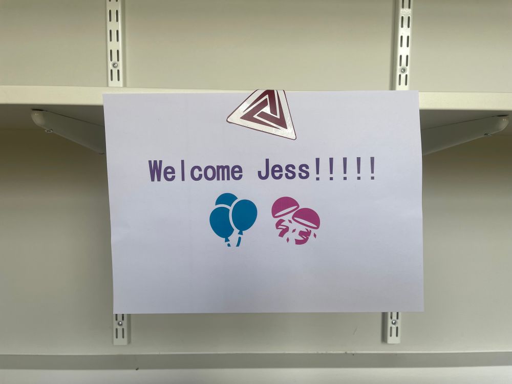 Image of a page on my shelf saying welcome Jess, with clip art of balloons and a sticker 