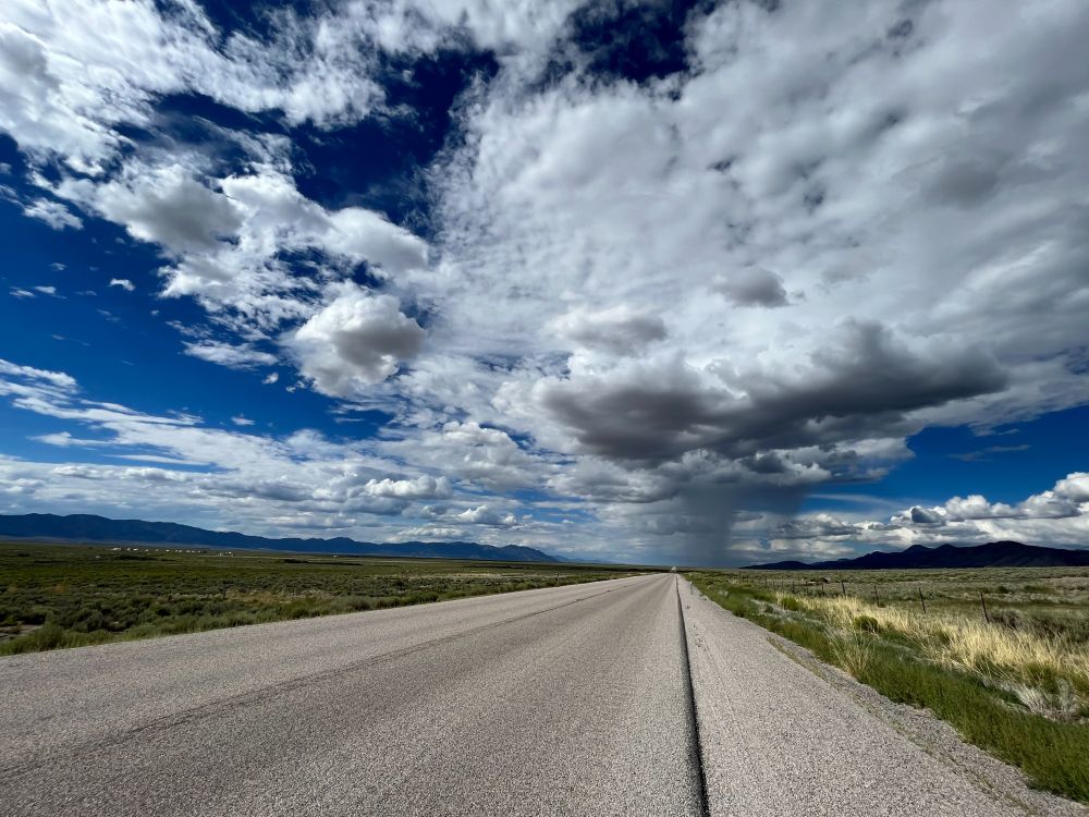 Open highway underneath clouds.