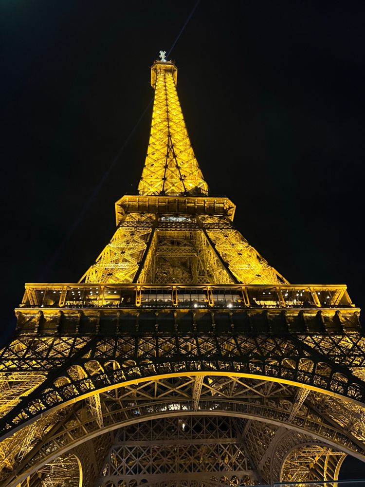 A pic of the real thing lit up in all her unmatched glory on a cool Parisian evening. The perspective is from almost directly below the base and slanted up for a telescoped view silhouetted against the dark night sky.