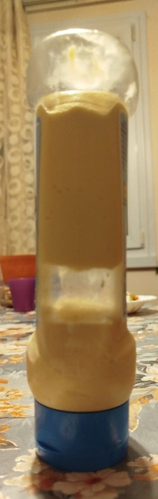 A tube of mayonnaise with an air bubble in the middle.