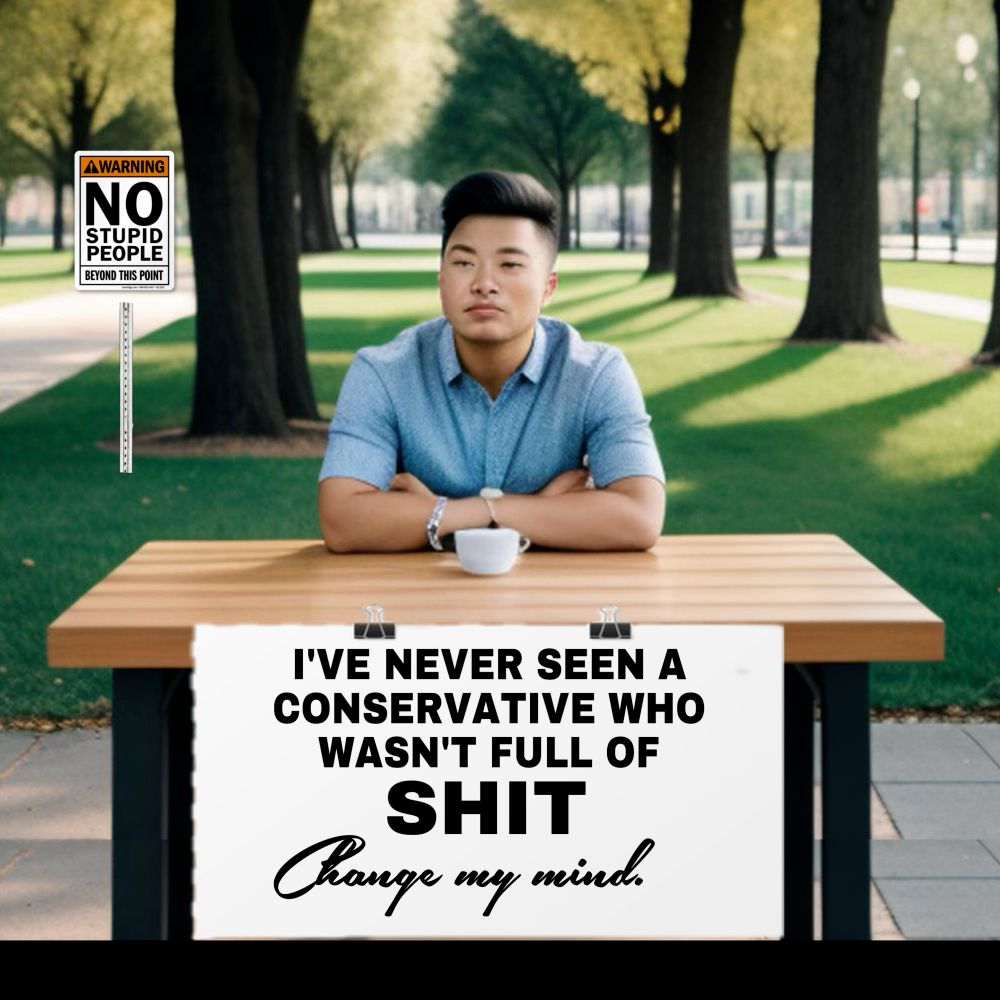 A man in a park sitting at a table with a sign that reads: 

I've never seen a "conservative" who wasn't full of shit. Change my mind.
