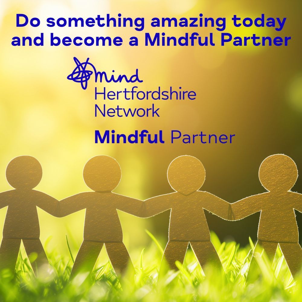 Bright background with sunlight and greenery. A row of paper chain figures holding hands stands in the foreground. Text reads, ‘Do something amazing today and become a Mindful Partner.’