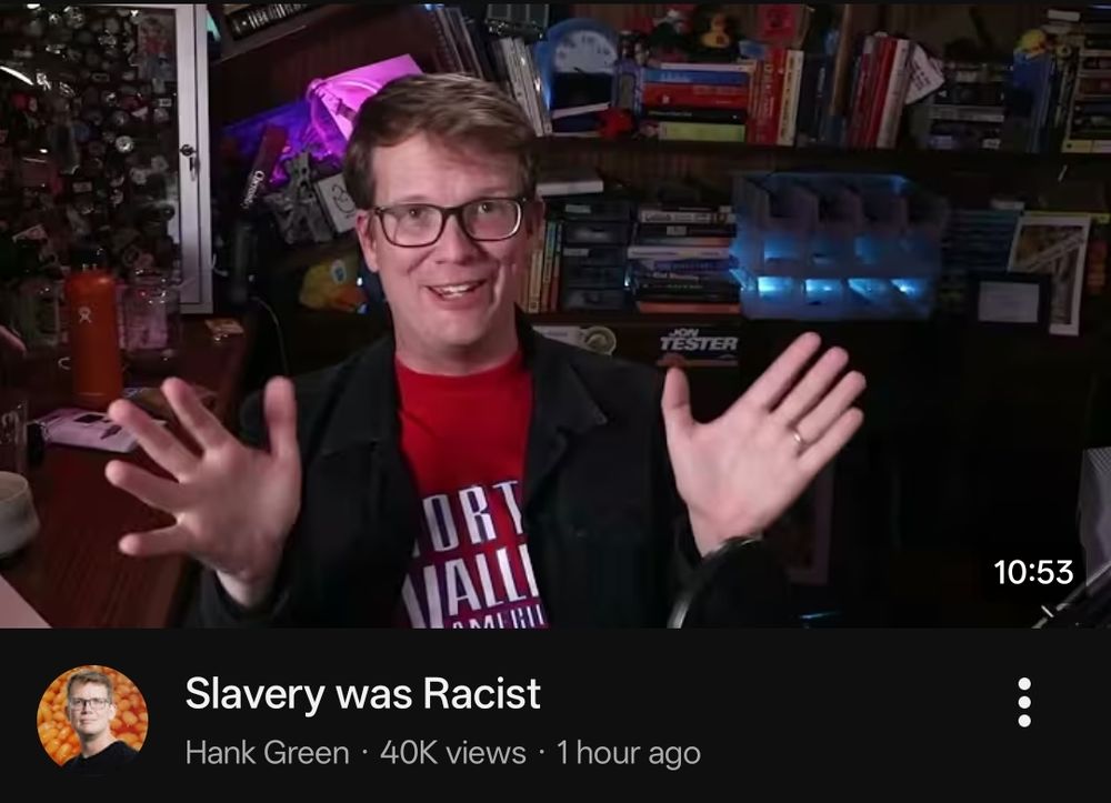 YouTube screenshot of a recommended Hank Green video titled "Slavery was Racist" with a standard thumbnail of an unedited video frame of Hank seemingly talking.