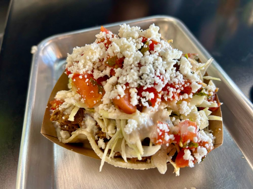 pork al pastor taco: marinated pork + pico de gallo + queso freco + green lettuce + pineapple habanero aioli