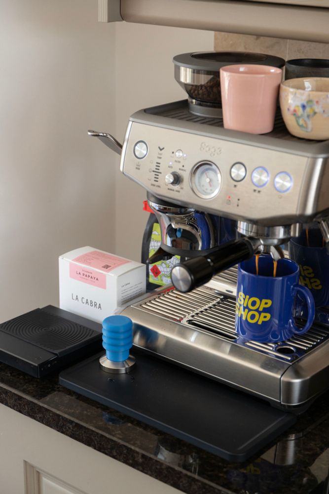Espresso machine with cup under neath spout.