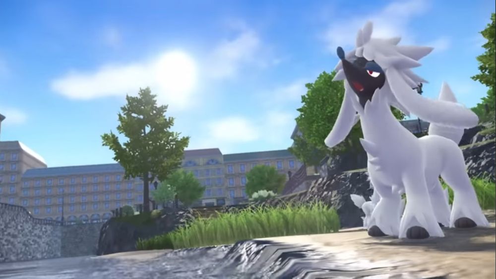 Furfrou (a white Pokemon poodle with a black face and paws) from a still of the Pokemon Legends ZA trailer in the Pokemon Presents announcement on 2/27/2025. Furfrou is in a wilds area, standing on the sandy bank of a small pond howling. There are trees and tall grass behind it. Charming buildings with green roofs are in the background. 