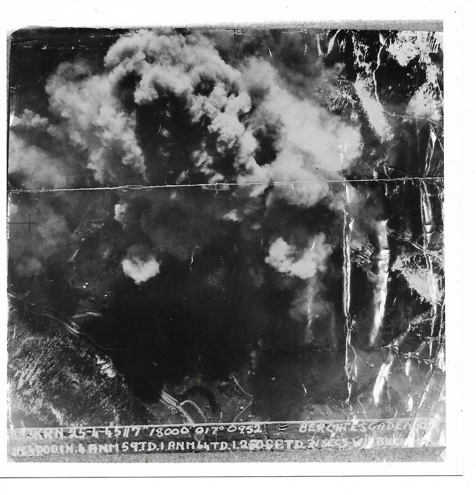 April 25, 1945 photo from a 166 Squadron RAF Lancaster showing bomb effects on Berchtesgaden SS camp. Bottom edge includes time, date and other details. My Uncle was the Bomb-aimer on this mission and this is his photo.