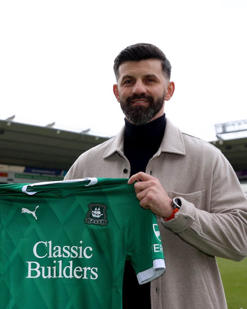 Miron Muslic at Home Park, holding up an Argyle home shirt.