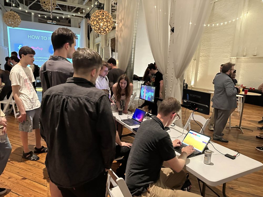 People playing Gimme 10 in the foreground, and other playtesting happening around