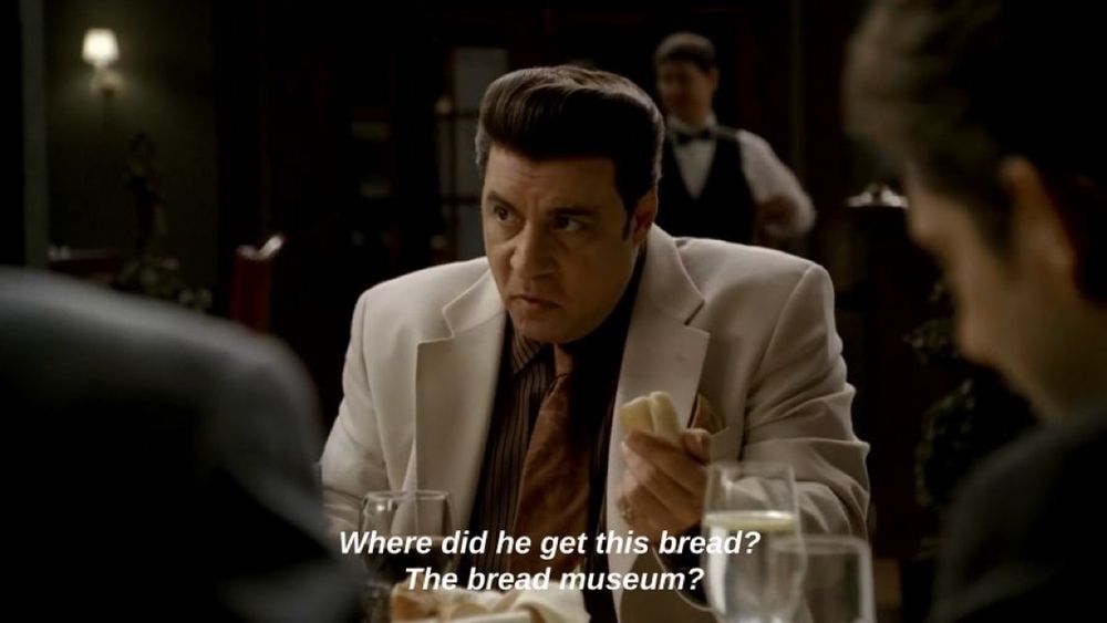 Silvio Dante from the Sopranos at Nuovo Vesuvio complaining about the old bread that Artie Bucco served them, saying "where did he get this bread? the bread museum?"