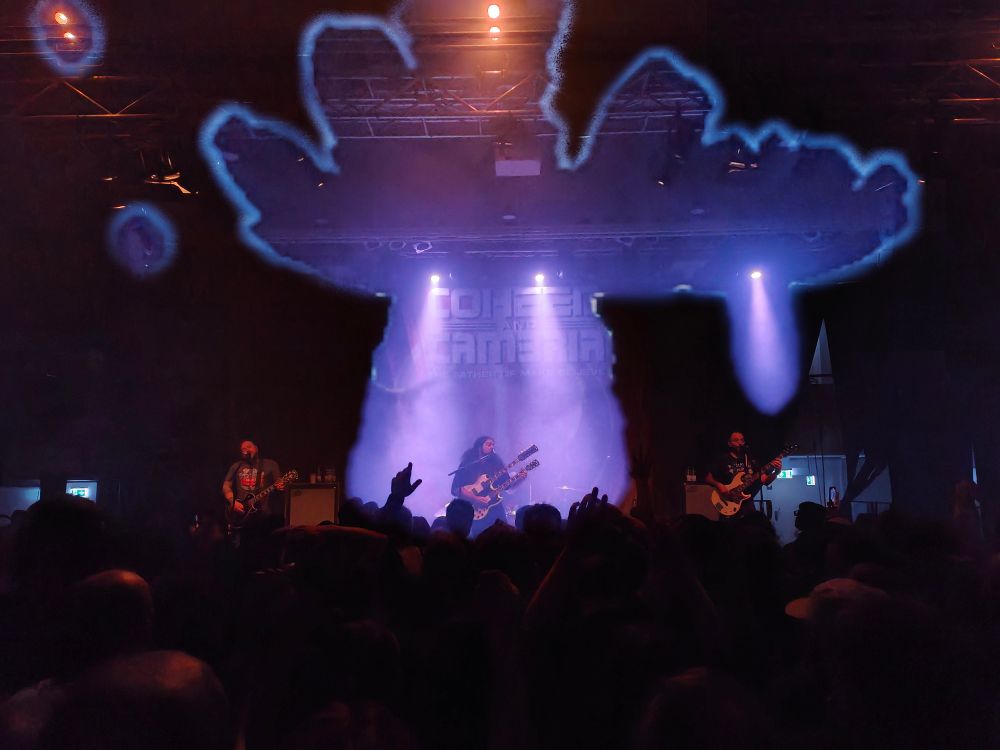 Coheed and Cambria on stage in Cologne. Claudio is playing a double necked guitar. The song is Welcome Home. The crows is going wild.