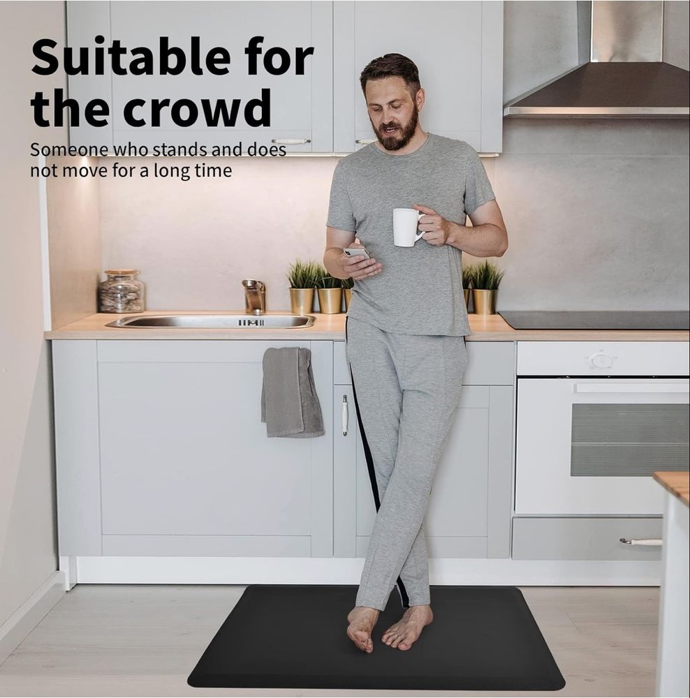 Photo of a man standing in his kitchen, mug in one hand, phone in the other. Caption inexplicably reads “Suitable for the crowd
Someone who stands and does not move for a long time”