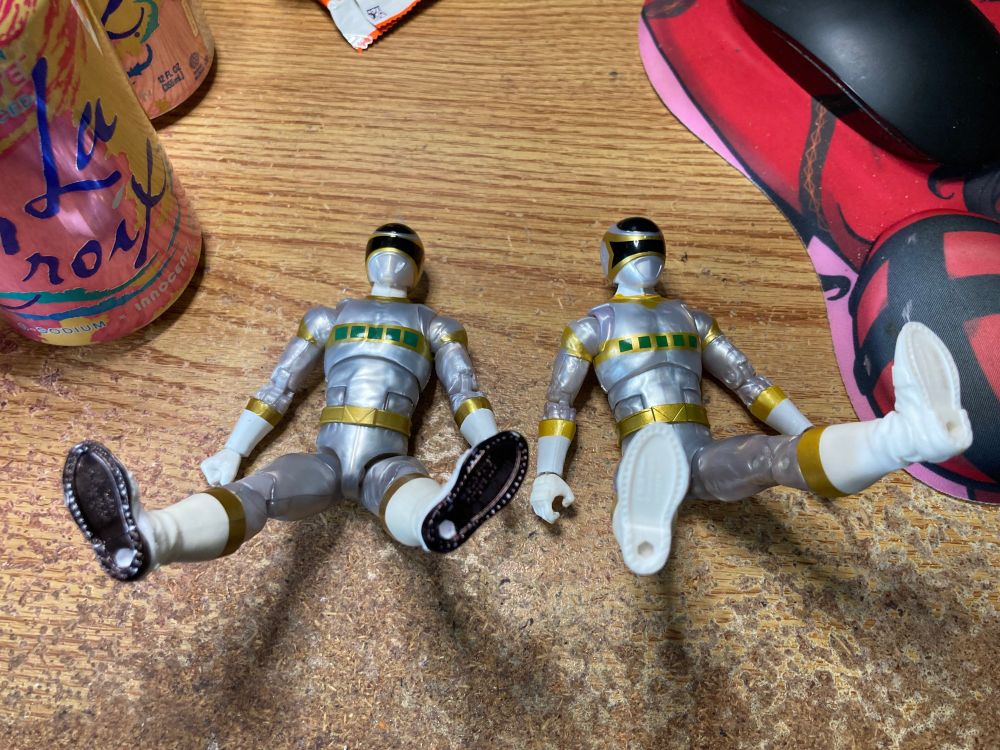 Both In Space Silvers with the legs up in the air to show off the black Sharpie on one  pair of boots and the lack of black on the other. I'm sure there's someone out there that's gonna add this to a password protected folder. 

Alternate description: 2 In Space Silvers to the iconic Green Ranger Tommy Crotch/Taint Jump-Kick