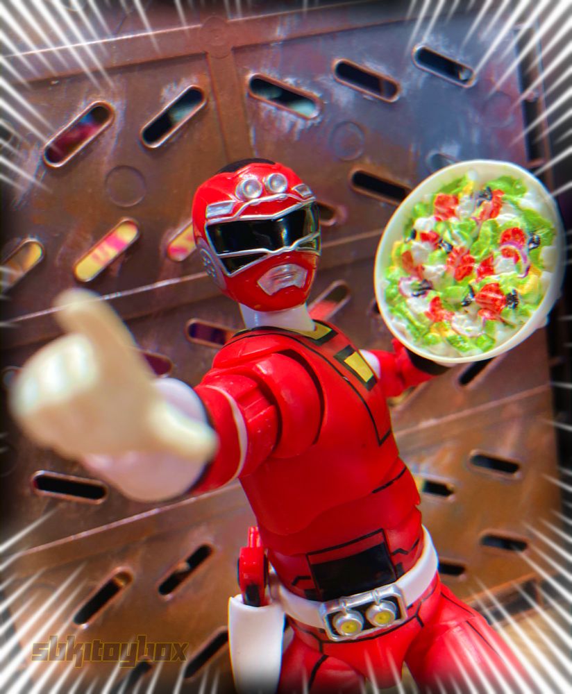 Photo of the Lightning Collection Red Turbo Ranger from Power Rangers Turbo. He points at the viewer while holding a salad. He's gonna toss the salad at you.