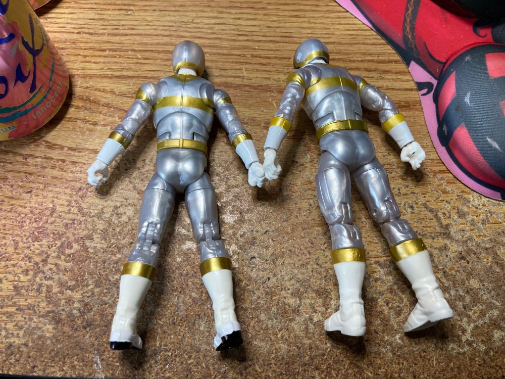 Both Silver Rangers are face down. The silver plastic really brings out the butt cheeks.