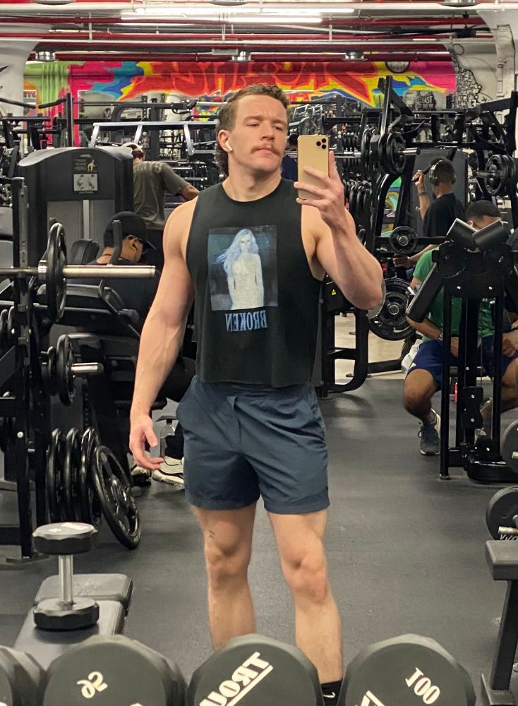 Gay Guy™️ at the gym wearing a Kim Petras crop top