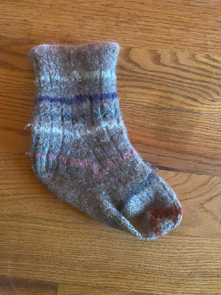 Shrunken wool sock before steeking 