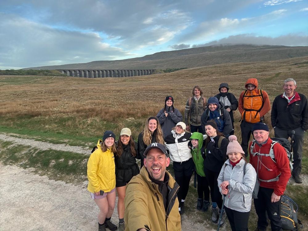 Picture of the New College team in front of Ribblehead viaduct
