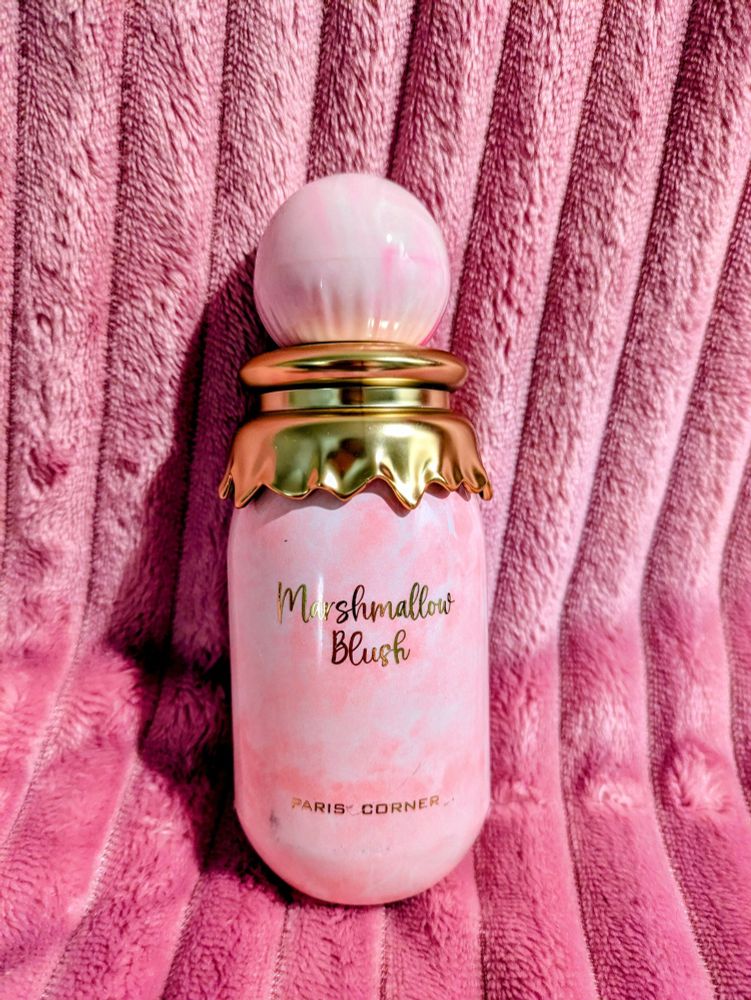 Pink and gold bottle of perfume called Marshmallow Blush 