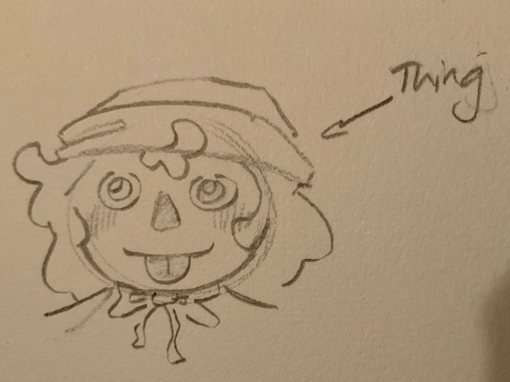 Raggedy Andy sticking his tongue out and staring like a little bug