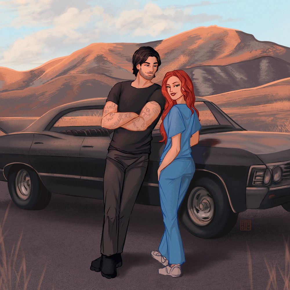 Man and a woman leaning on a black car in the desert. She is a redhead wearing scrubs and he’s got black hair and tattoos.