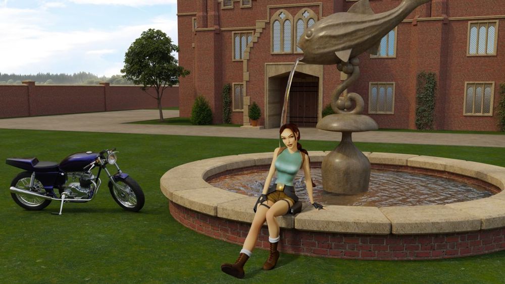A loading screen image of Lara Croft sitting on the side of an ornate fountain with a fish statue in it, in front of her mansion, with her blue motorcycle on the grass next to her.