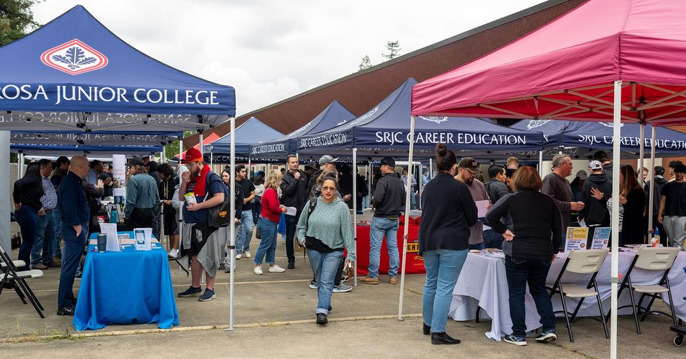 Employers and students discuss at various booths during a hiring event organized at Santa Rosa Junior College.