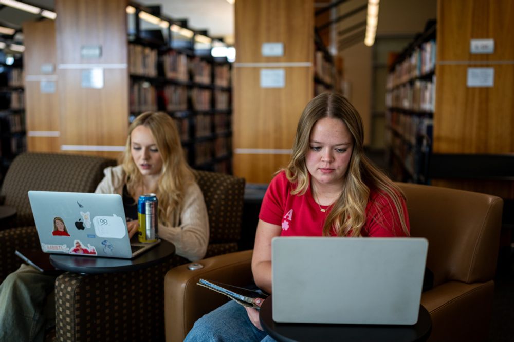 Two female students work on laptops in the Mahoney Library at Santa Rosa Junior College Petaluma.
