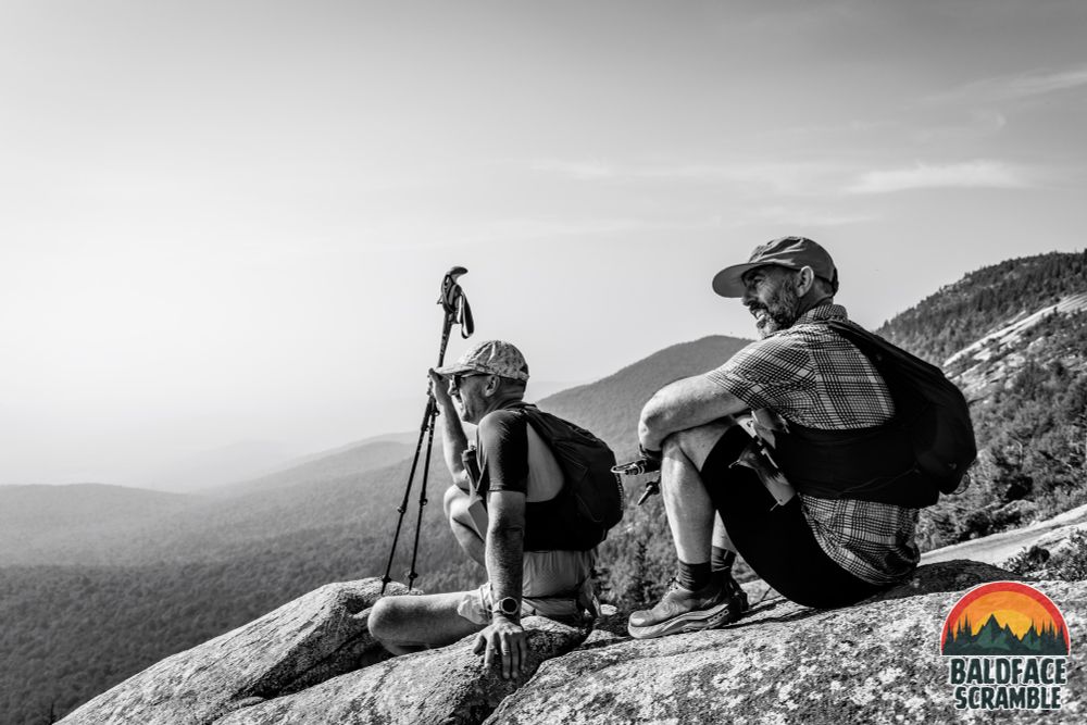 Runners sitting in mountain

