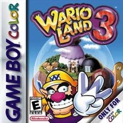 Box art for Wario Land 3 for the Gameboy Color. It features Wario smiling in front of a small music box diarama. 