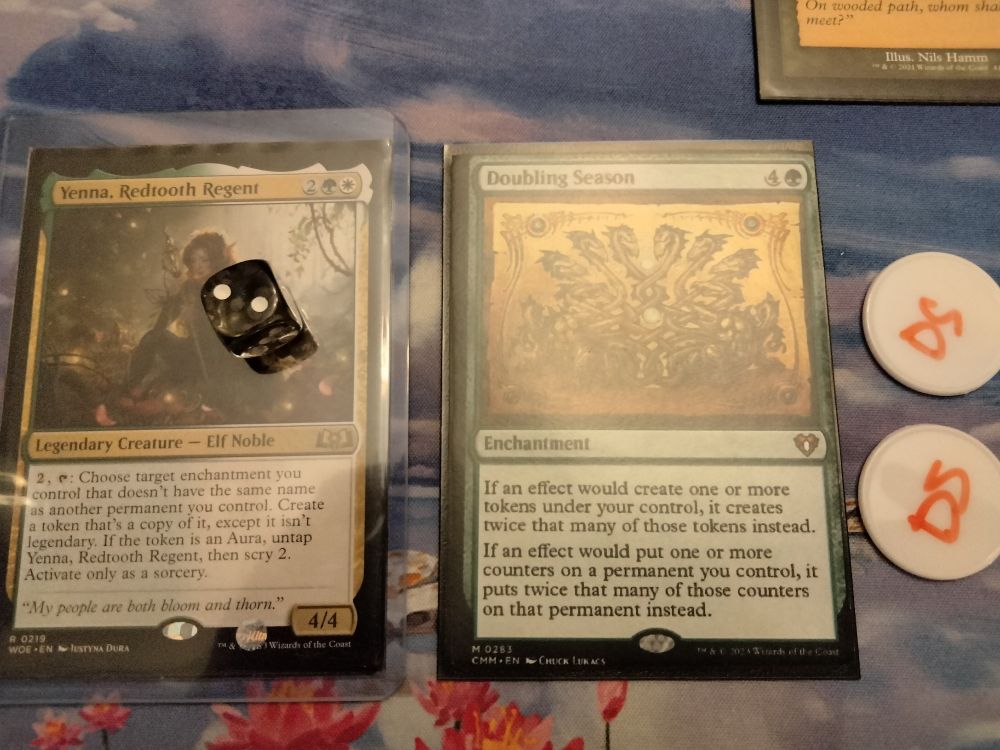 Yenna, Redtooth Regent, Doubling Season, and two Doubling Season tokens.
