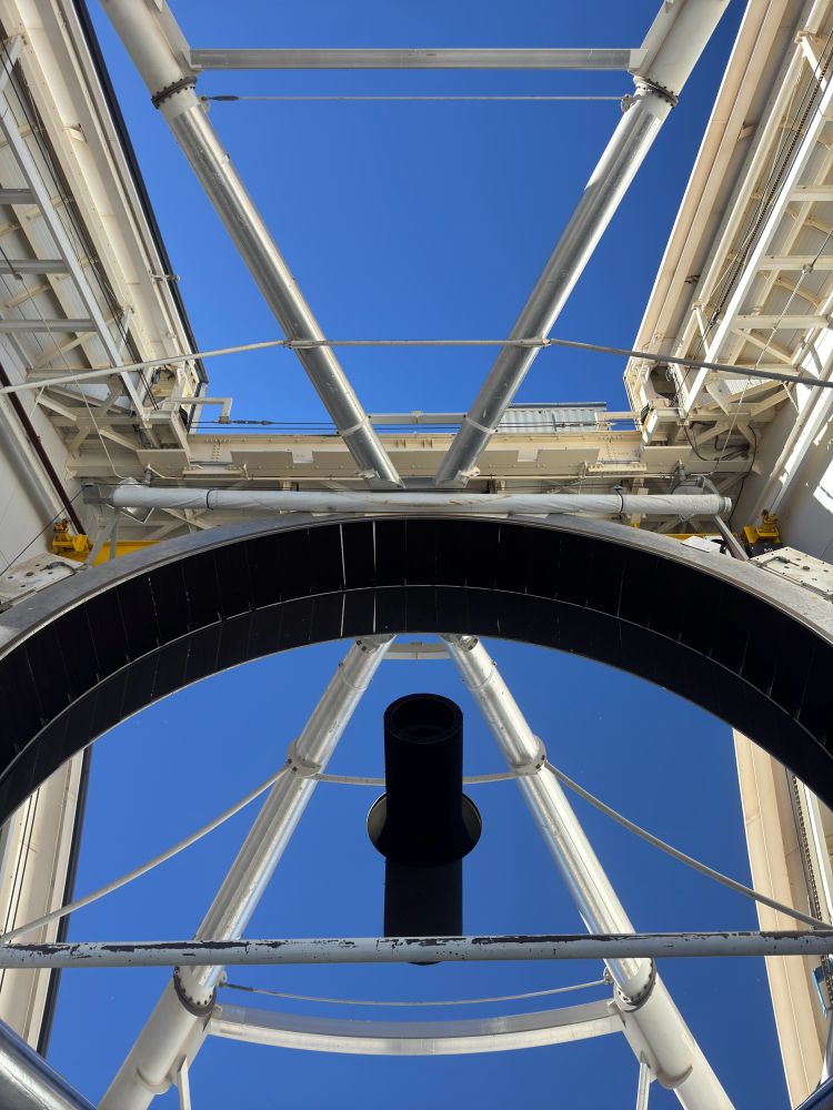 view of blue sky reflected in the primary mirror of the MMT Observatory 
