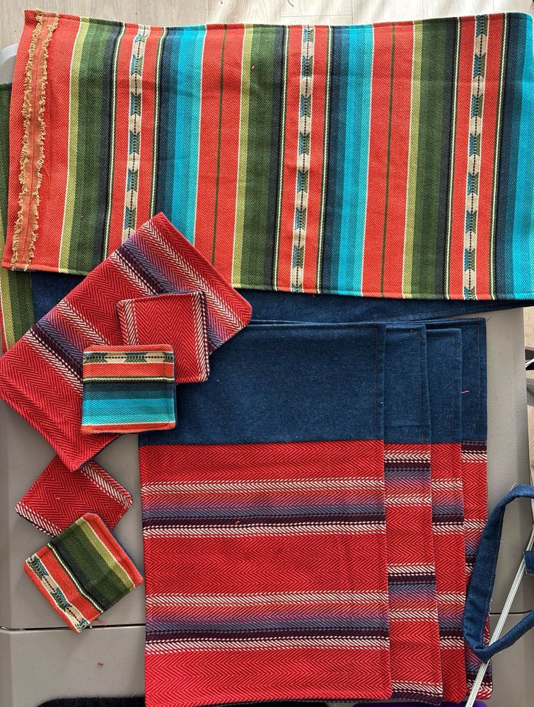 Multicolored brightly striped collection of placemats and coasters