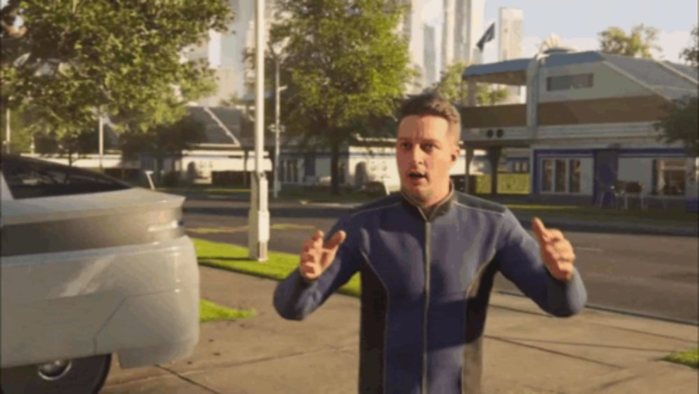 a man in a blue jacket is standing on a sidewalk with his arms outstretched in front of a car