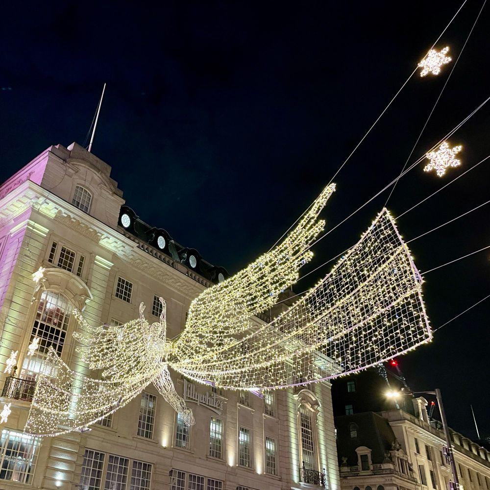 Christmas lights in the shape of angels hanging above Regent Street 