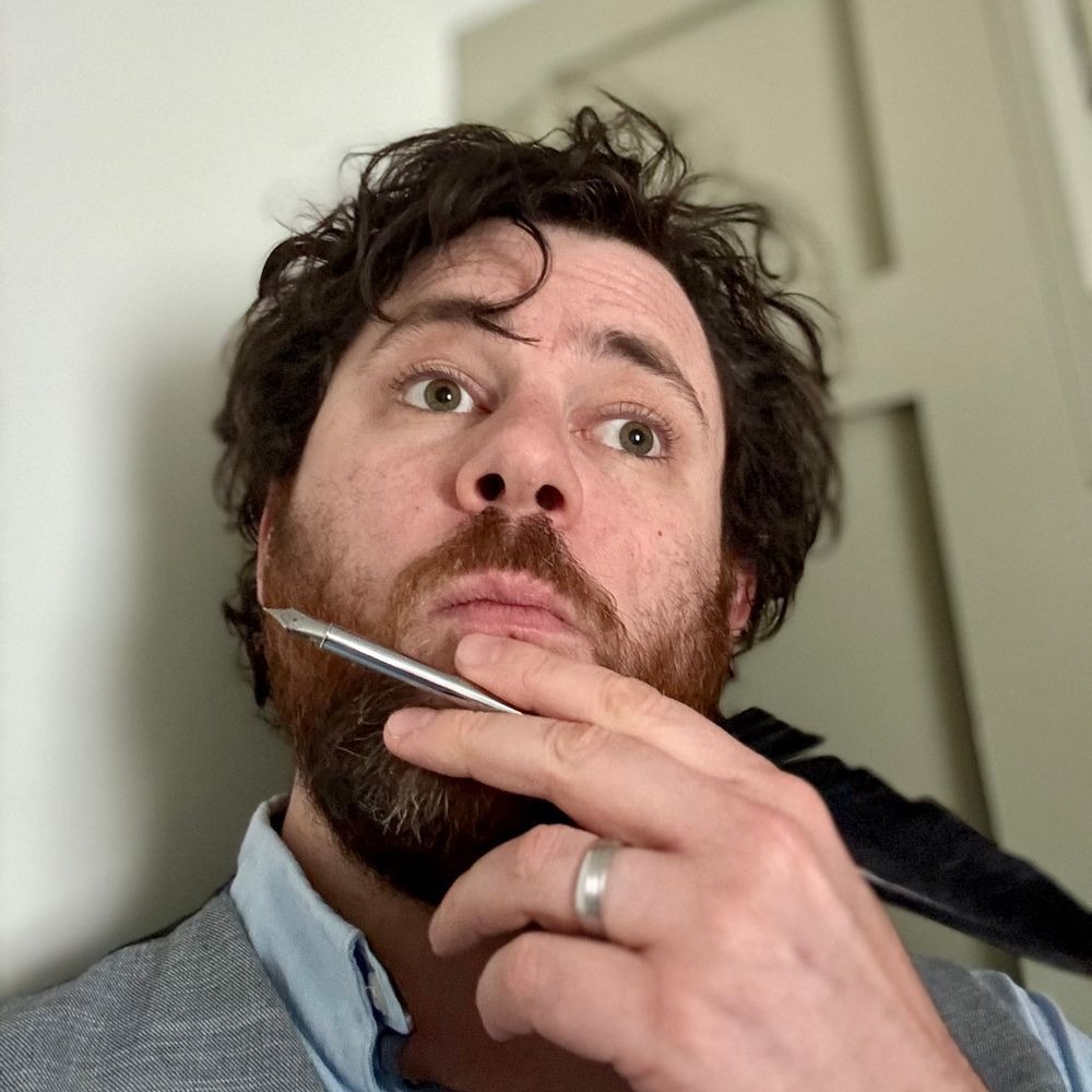 Me looking well thoughtful as I ponder something, my hand, holding a quill, resting on my chin. Thoughtfully.