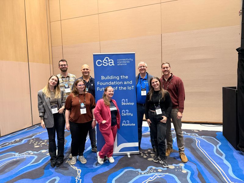 Colleagues and me of the Open Home Foundation in front of a CSA banner